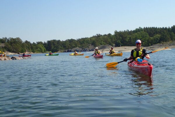 A group of people kayaking in the archipelago sea