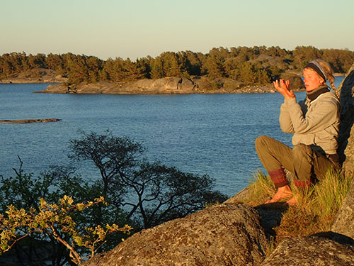 Elin Maria listening to the archipelago Nature in front of the sea